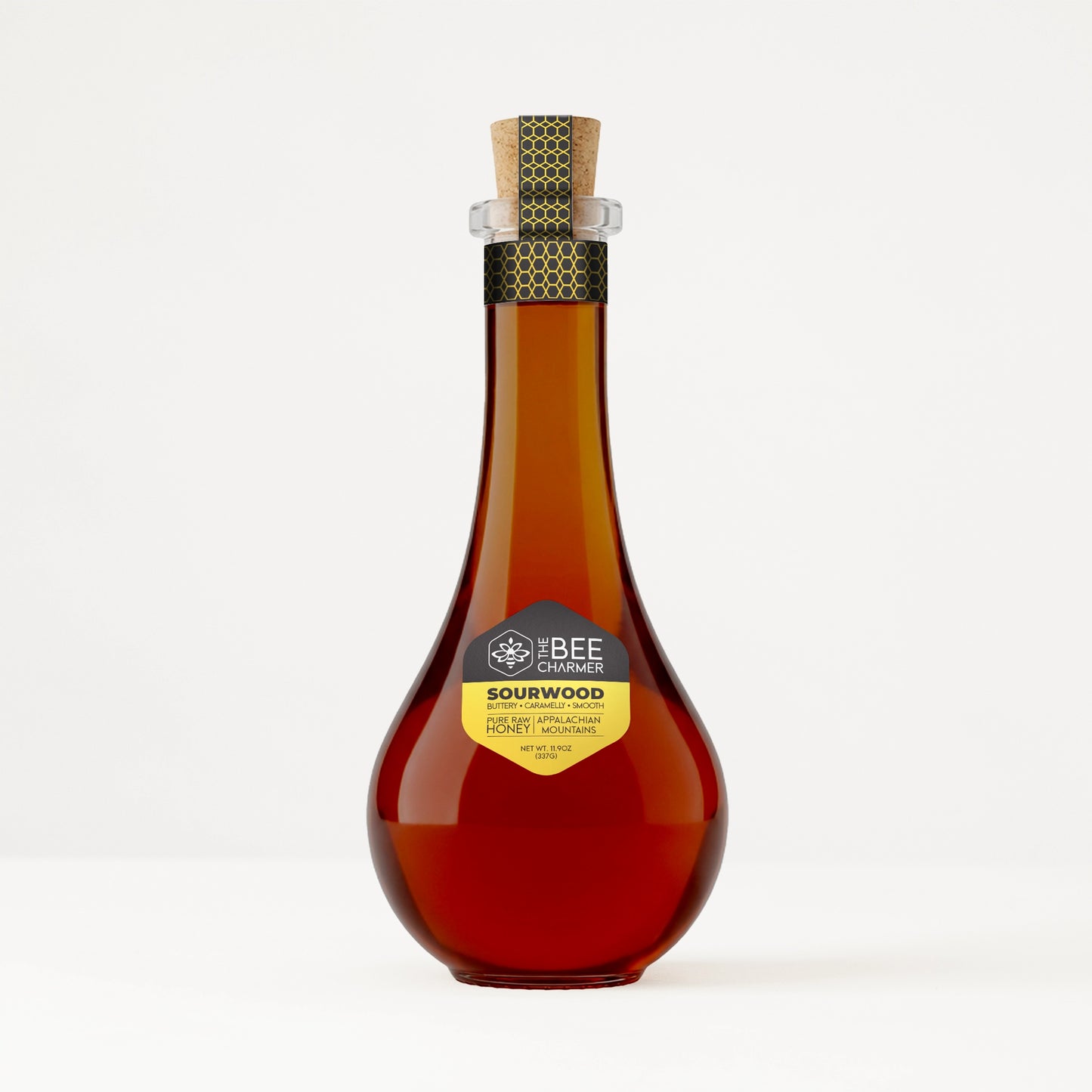 Pure raw Sourwood Honey in a decorative Bee Charmer branded 11.9oz glass tear-drop bottle.  Great for gifting and displaying.