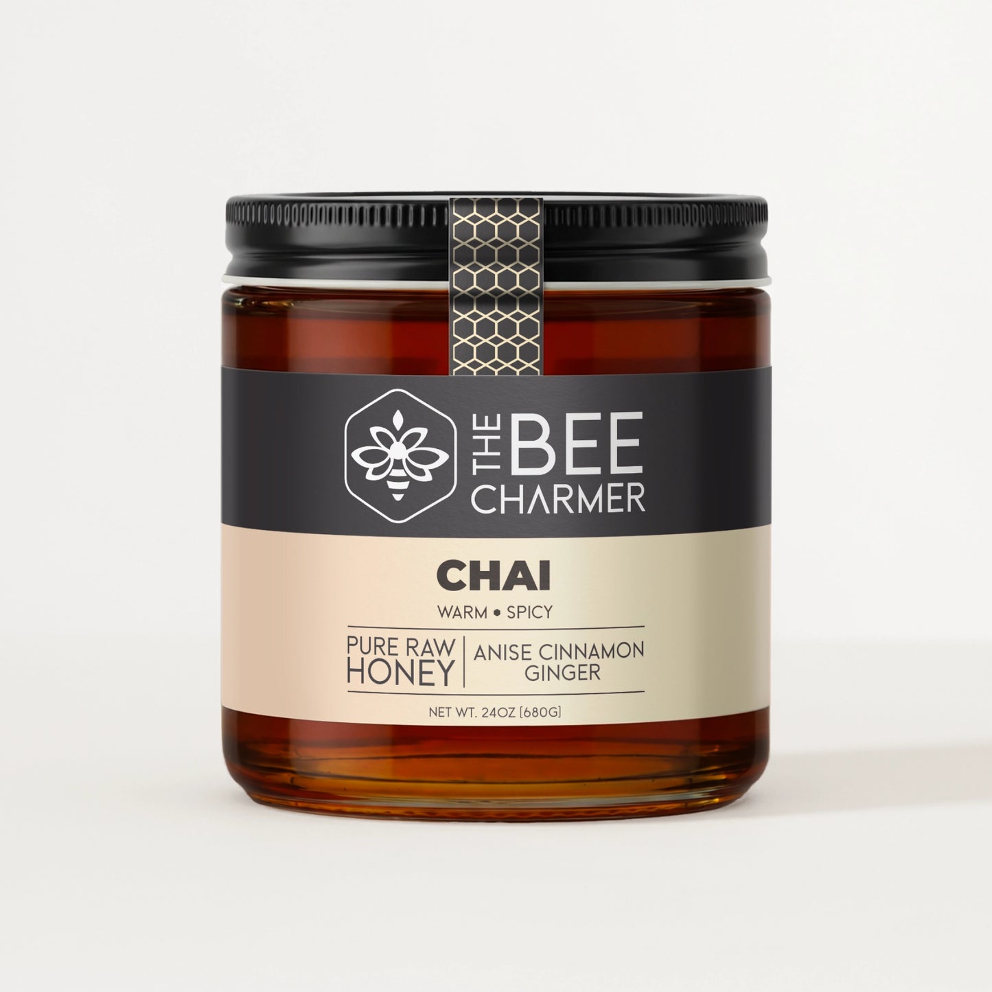 Anise Cinnamon Ginger-infused Chai Honey in a signature Bee Charmer branded 24oz wide-mouth glass jar.  This is our largest available size.