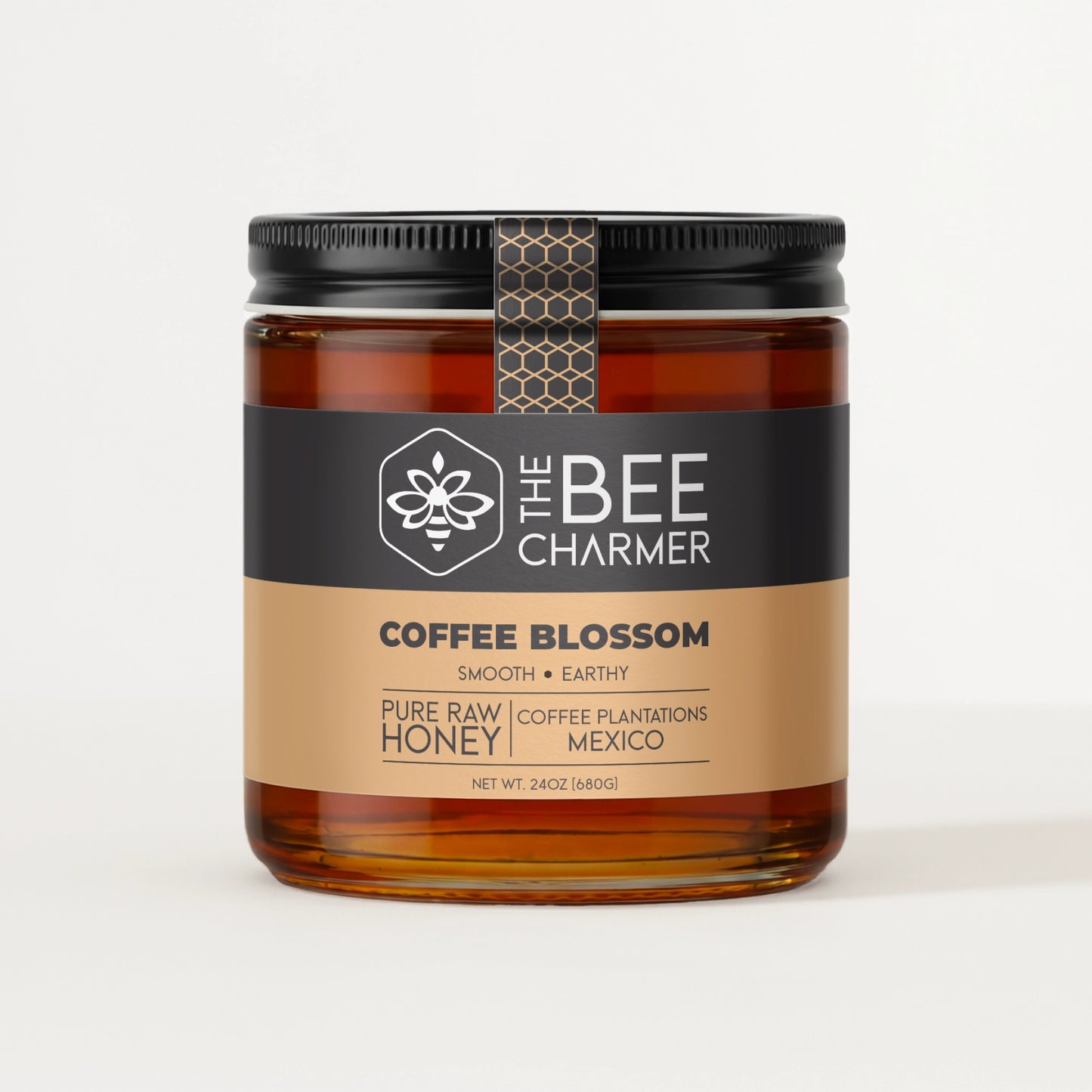 Pure raw Coffee Blossom Honey in a signature Bee Charmer branded 24oz wide-mouth glass jar.  This is our largest available size.
