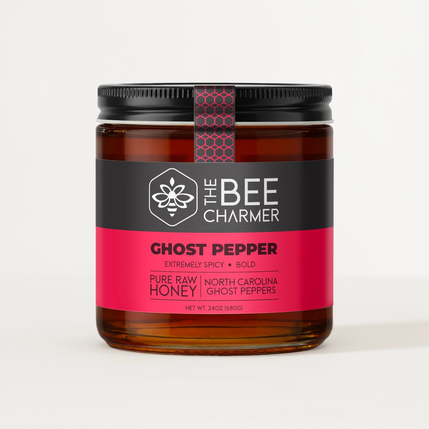 Hot pepper-infused Ghost Pepper Honey in a signature Bee Charmer branded 24oz wide-mouth glass jar.  This is our largest available size.