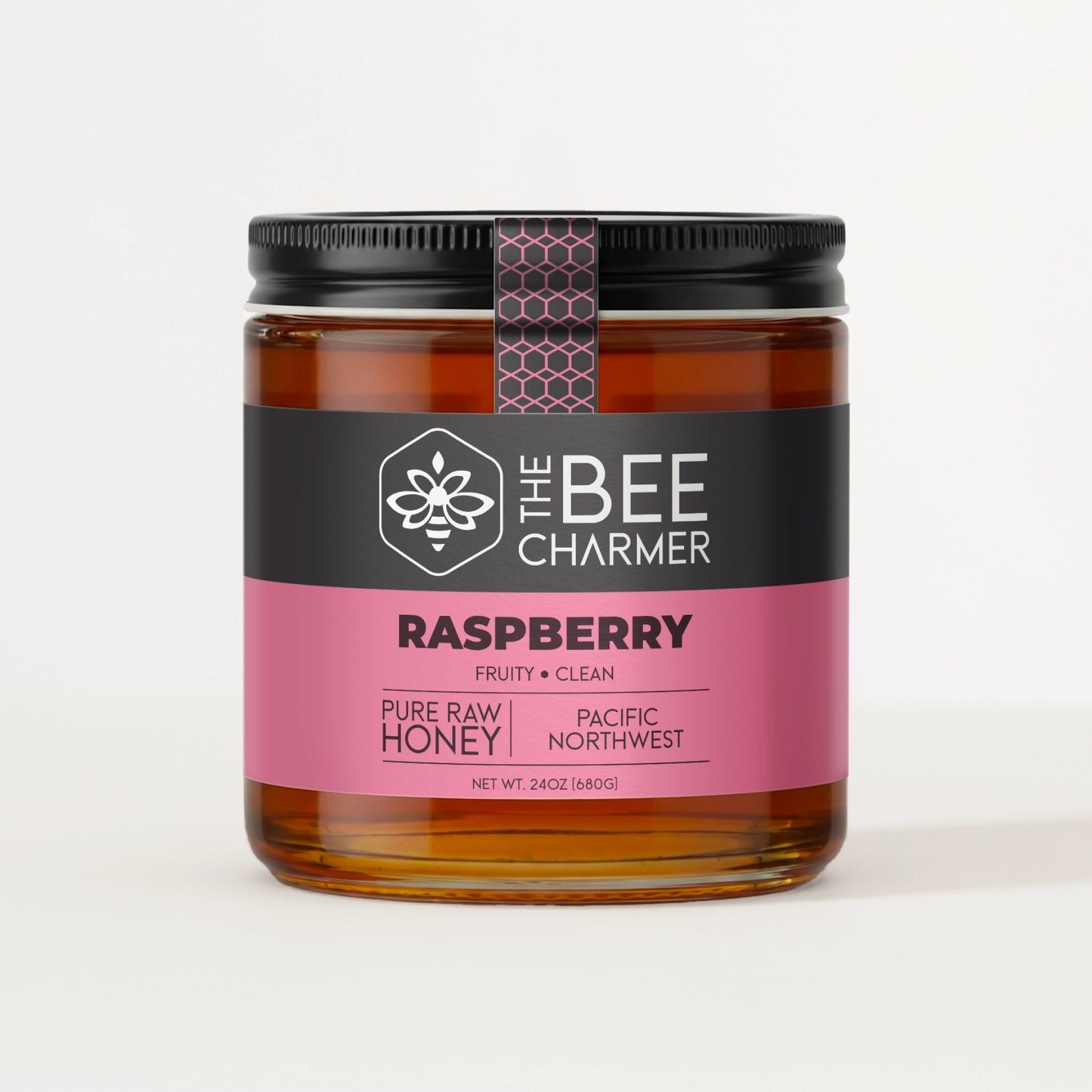 Pure raw Raspberry honey in a signature Bee Charmer branded 24oz wide-mouth glass jar.  This is our largest available size.