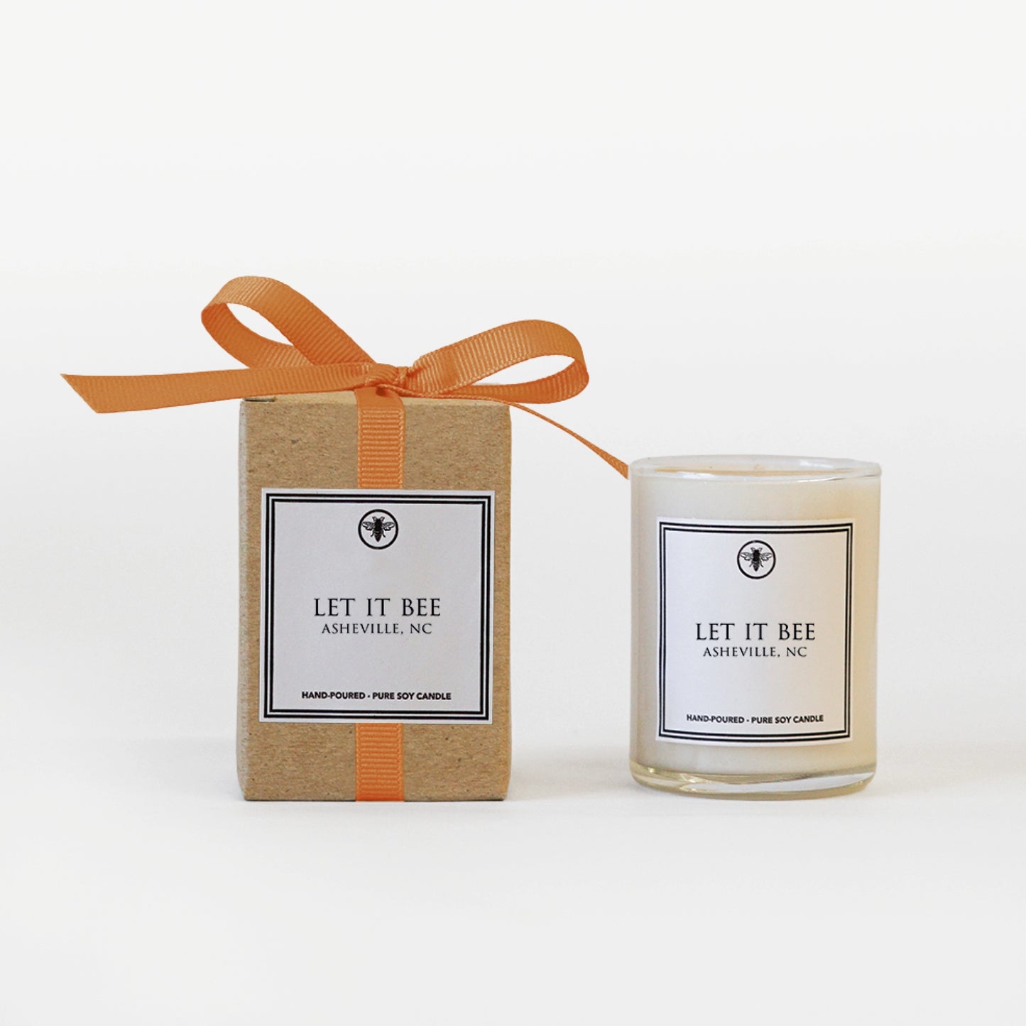 A small, hand-poured, pure soy candle with a “Let It Bee” inspirational message by The Bee Charmer
