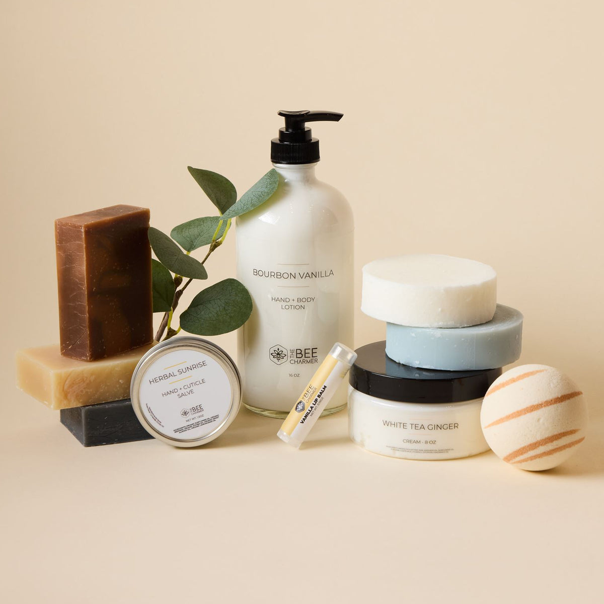 The complete Bee Charmer body care collection: lotion, cream, salve, lip balm, bar soaps and bath bomb