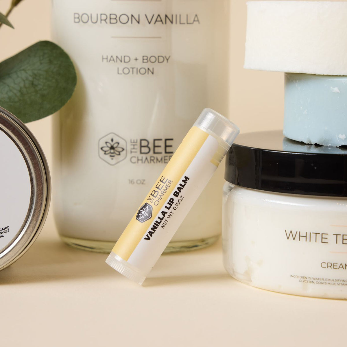The Bee Charmer skincare: Hand & Body Lotion, Hand & Cuticle Salve, Beeswax Lip Balm and body cream